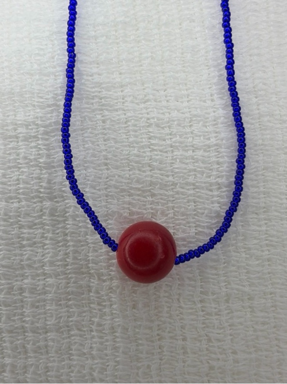 LileeLoo Handmade Blue Beaded Necklace with Red Focal Bead